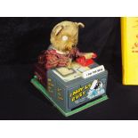 An unboxed vintage tinplate battery operated Teddy Bear toy 'I am the Boss',