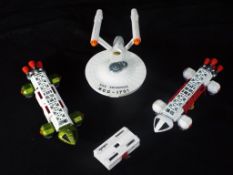 Dinky - Three unboxed Dinky space related vehicles.