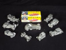 A good collection of nine pewter model motor vehicles including 1930 Bentley Barnato,