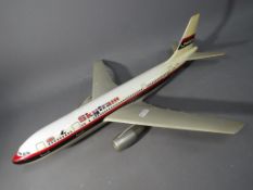 A plastic composition travel agents model Airbus A300 in Laker Airways 'Skytrain' livery,