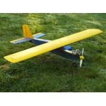 A remote control model aircraft with fuel engine. Wingspan measures approximately 126cms.