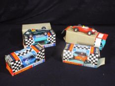 Scalextric - Four boxed vintage Scalextric racing cars.