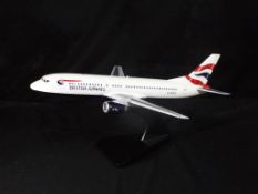 Bravo Delta Models - A boxed wooden 1:150 scale Boeing 737-400 Airliner finished in British Airway