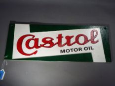 A cast iron advertising sign marked Castrol This lot must be paid for and removed no later than