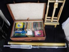 A vintage suitcase containing a quantity of Ladybird Books and other childrens books and puzzles,