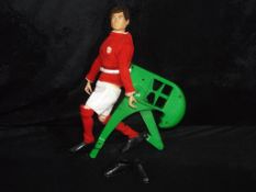 Palitoy - An unboxed Palitoy Vintage Action Man Sharp-Shooter Footballer in Manchester United Kit.