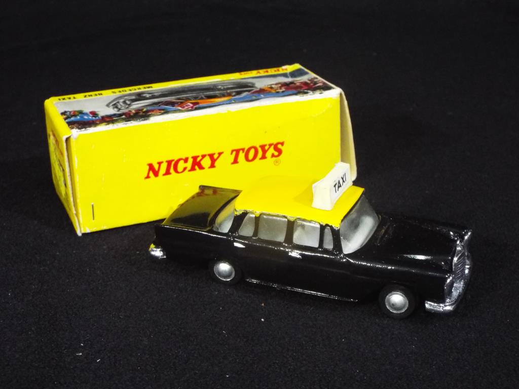 Nicky Toys - A boxed Nicky Toys 051 Mercedes Benz Taxi; black body, yellow roof, - Image 2 of 3