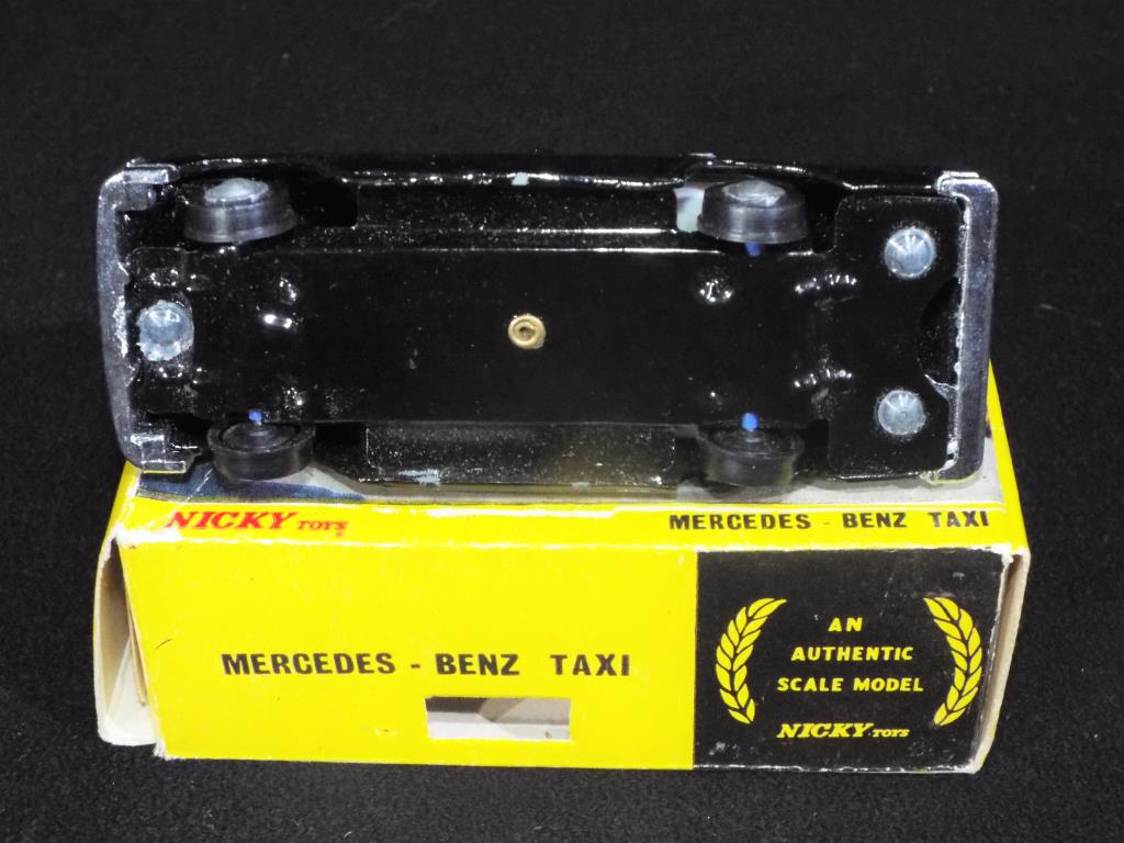 Nicky Toys - A boxed Nicky Toys 051 Mercedes Benz Taxi; black body, yellow roof, - Image 3 of 3