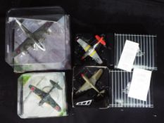 Corgi Aviation Archive, Matchbox Collectibles - Four boxed diecast model aircraft in various scales.