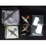 Corgi Aviation Archive, Matchbox Collectibles - Four boxed diecast model aircraft in various scales.