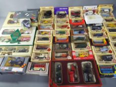 Lledo, Corgi, Matchbox - a collection of model vehicles to include various vans, buses and cars,