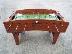 A Solex table football game with footballs,