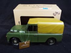 An unpainted metal Land Rover four by four Jeep with original tags and a box [VGEEP].