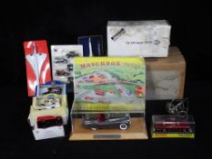 Danbury Mint, Dinky, Matchbox - A collection of 9 diecast vehicles, a vintage gyroscope,