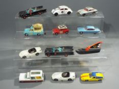 Corgi, Dinky, Politoys - 12 unboxed diecast and plastic model vehicles.