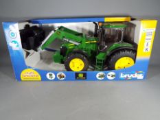 Retail Stock - a Bruder box John Deere 7930 tractor scale 1:16 in mint condition.