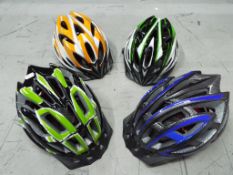 Unused Retail Stock - four unused bicycle helmets.