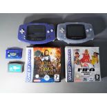 Nintendo - Two Nintendo Game Boy Advance hand held game consoles with four games comprising FIFA