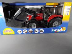 A boxed Bruder Massey Ferguson 7624 tractor in mint condition, scale 1:16.