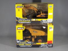 Huina - Two boxed Huina construction diecast model vehicles.