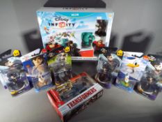 Disney Infinity Wii - unused retail stock, a boxed starter pack, also Donald Duck, Baloo,