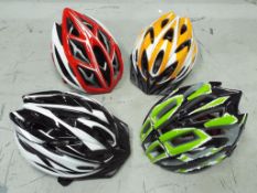 Unused Retail Stock - four unused cycle helmets.