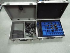 Warhammer - Two metal flight cases containing in excess of 40 Warhammer figures.