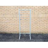 An unbranded grey metal shop display stand with 10 fixed metal shelves.