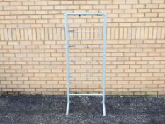 An unbranded grey metal shop display stand with 10 fixed metal shelves.