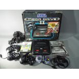 Sega - A boxed Sega Mega Drive II games console with six controllers,