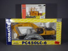 Joal - Two boxed diecast model construction vehicles.