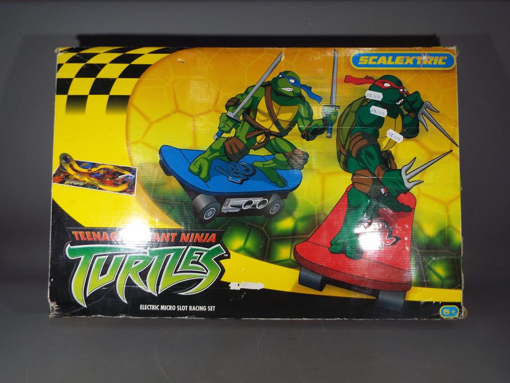 Retail Stock - a Scalextric Teenage Mutant Ninja Turtle box set, box has some creases.