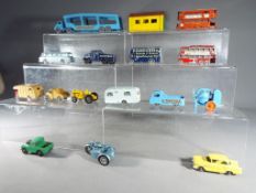 Matchbox - fifteen diecast model motor vehicles and one garage,
