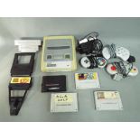 Nintendo - A Nintendo SNES game console with three controllers,