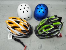 Unused Retail Stock - four unused cycle helmets.