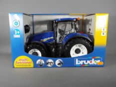 Bruder - A Bruder New Holland T7-315 1:16 scale plastic model tractor.