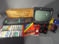 Amstrad - A boxed Amstrad CPC 464 personal computer, with instructions, monitor, joystick and games.