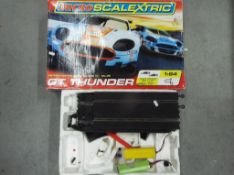 Scalextric - A boxed Micro Scalextric GT Thunder Set with a quantity of vintage Scalextric track.