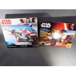 Retail Stock - a boxed Star Wars Desert Landspeeder with Finn (Jakku) figure together with Star