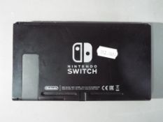 Nintendo - An unboxed Nintendo Switch console (no controllers or accessories),