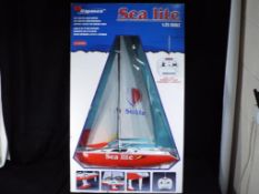 Sea Lite - A boxed Sea Lite Remote Controlled 1:25 model Yacht.