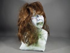 Creature Features - A resin bust of the character 'Regan' from the film 'The Exorcist''.