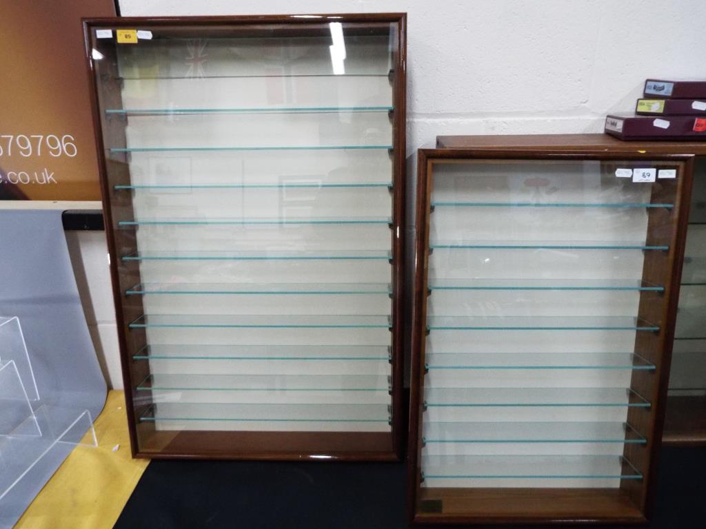 Two good quality display cases with shelves, the larger approximately 83 cm x 55 cm x 9 cm,