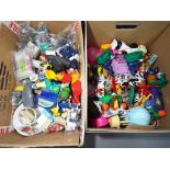 Vintage Toys - two boxes containing a large quantity of mainly vintage McDonalds collectible toys