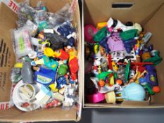Vintage Toys - two boxes containing a large quantity of mainly vintage McDonalds collectible toys