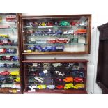 Two wall mountable display cases, one 30 cm x 55 cm x 9 cm and the other 28 cm x 53 cm x 9 cm,