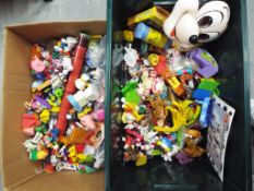 Vintage Toys - two boxes containing a quantity of vintage McDonalds collectible toys and similar