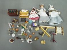 A quantity of high quality dolls house furniture to include ceramics, food items, servants,