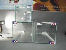 Three glass display cases, the largest approximately 26 cm x 46 cm x 25 cm.