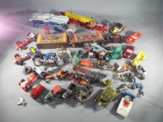 Corgi, Matchbox, Dinky - In excess of 25 unboxed diecast model vehicles in various scales.